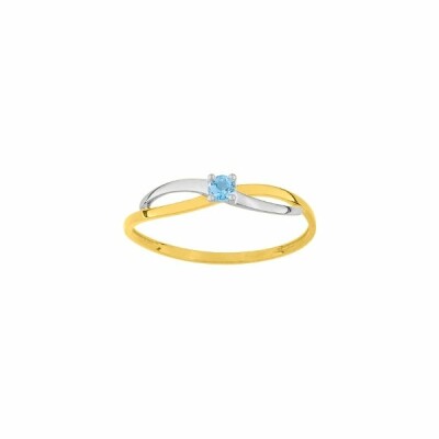 Bague en or jaune, or blanc et topaze bleue