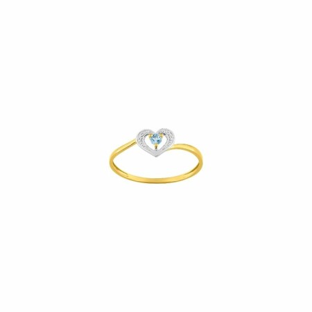 Bague en or blanc, or jaune et topaze bleue