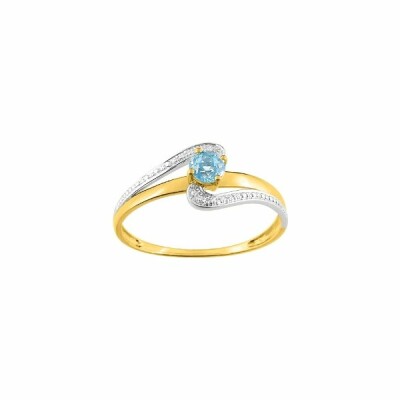 Bague en or jaune, or blanc et topaze bleue