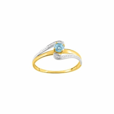 Bague en or jaune, or blanc et topaze bleue