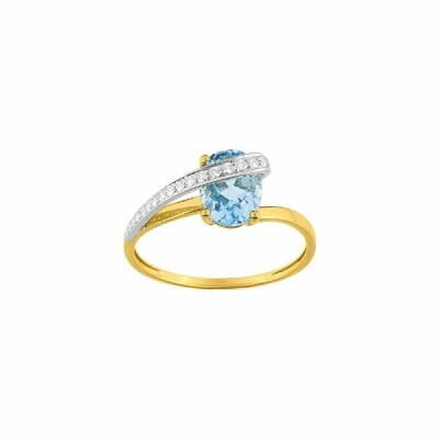 Bague en or jaune, or blanc, oxydes de zirconium et topaze bleue