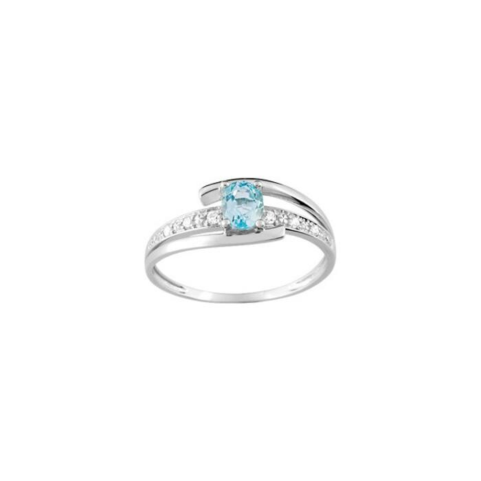 Bague en or blanc, topaze bleue et oxydes de zirconium