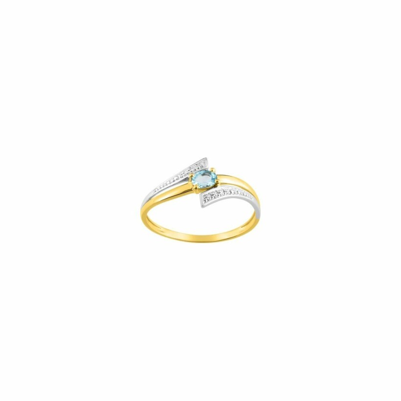 Bague en or blanc, or jaune et topaze bleue