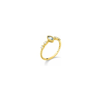 Bague en or jaune et topaze bleue traitée et oxyde de zirconium