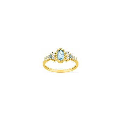 Bague en or jaune et topaze bleue traitée et oxyde de zirconium