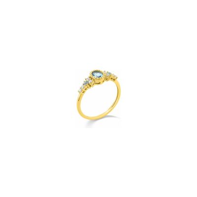 Bague en or jaune et topaze bleue traitée et oxyde de zirconium