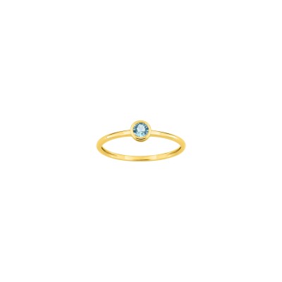Bague en or jaune et topaze bleue