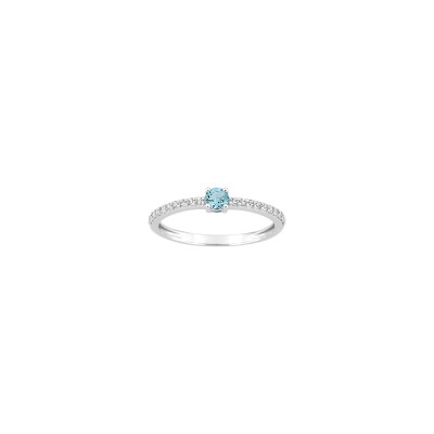 Bague en or blanc, oxyde de zirconium et topaze bleue
