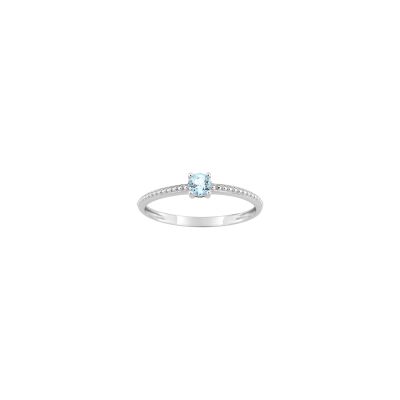 Bague en or blanc et topaze bleue