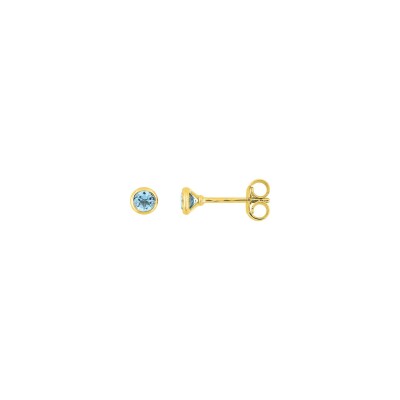 Clous d'oreilles en or jaune et topaze bleue