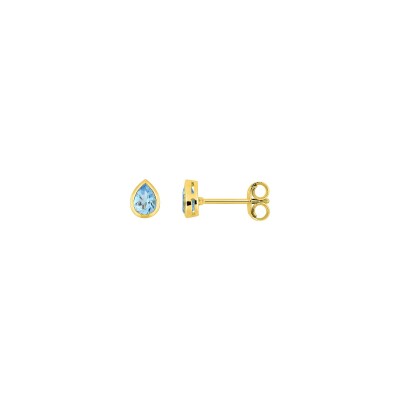 Boucles d'oreilles clous en or jaune et topaze bleue