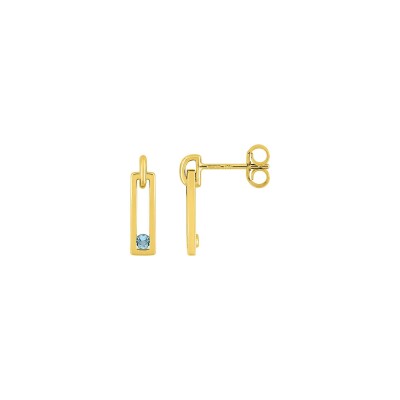 Clous d'oreilles en or jaune et topaze bleue