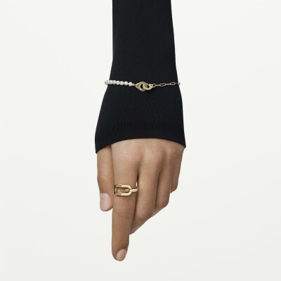 Bracelet Dinh Van de perles Menottes dinh van XS en or jaune et perle d'eau douce