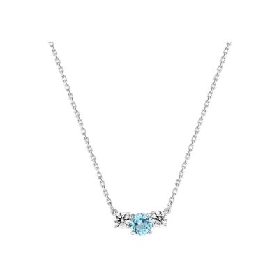 Collier en or blanc, topaze bleue et oxyde de zirconium