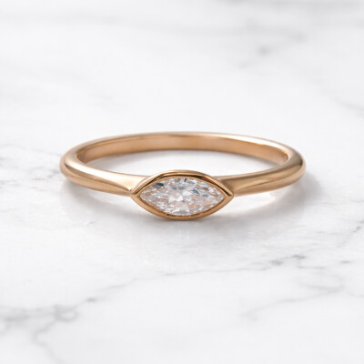 Solitaire or rose et diamants navette serti clos