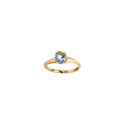 Bague en or jaune et topaze bleue
