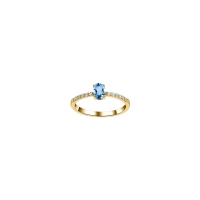 Bague en or jaune, topaze bleue et oxyde de zirconium