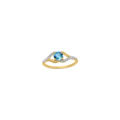 Bague en or jaune, rhodium, topaze bleu London et oxyde de zirconium