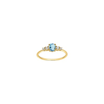 Bague en or jaune, topaze bleue et oxyde de zirconium