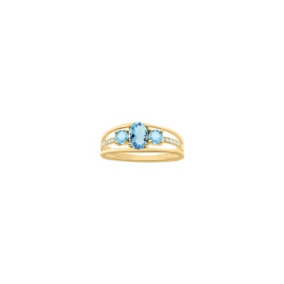 Bague en or jaune, topaze bleue et oxyde de zirconium