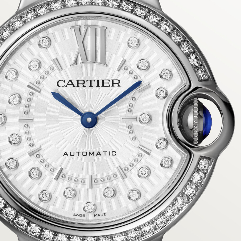 Ballon Bleu de Cartier watch, 33 mm, mechanical movement with automatic winding. 
Steel case, fluted steel crown set with a synthetic cabochon-shaped spinel.
 
Steel bezel set with 50 diamonds totaling 0.57 carats. Matte silvered sunray-brushed dial set with 21 brilliant-cut diamonds totaling 0.10 carats. 
Blued-steel sword-shaped hands. Sapphire crystal. Interchangeable steel bracelet. Case diameter: 33 mm, thickness: 10.16 mm. Water-resistant up to 3 bar (approx. 30 meters/100 feet).