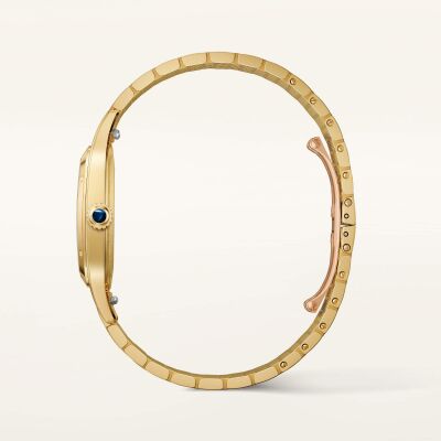 Montre Santos-Dumont de Cartier Grand modèle, mouvement manuel, or jaune, bracelet métal interchangeable