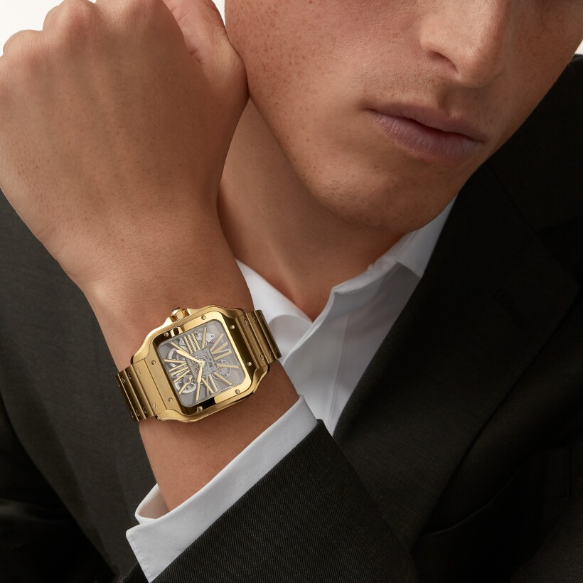 Santos de Cartier Large model, manual skeleton movement, yellow gold, interchangeable metal and leather straps watch