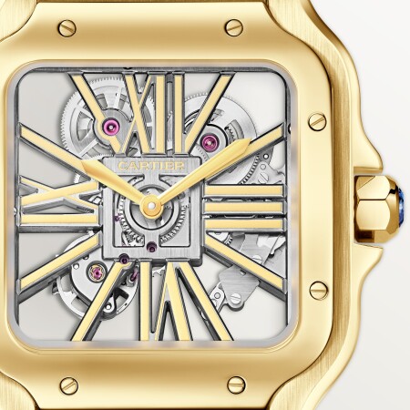 Montre Santos de Cartier Grand modèle, mouvement manuel squeletté, or jaune, bracelets métal et cuir interchangeables