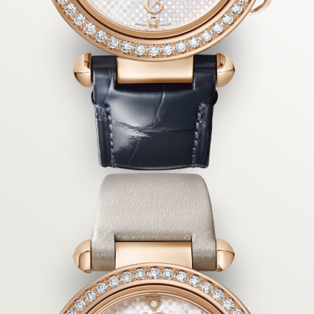 Pasha de Cartier watch, 35 mm, mechanical movement with automatic winding, caliber 1847 MC. Rose gold 750/1000 case set with 48 brilliant-cut diamonds totaling 1.15 carats, fluted crown cap and crown set with sapphires. Silvered engraved dial set with 12 brilliant-cut diamonds totaling 0.03 carats, blued-steel diamond-shaped hands. 1 blue alligator-skin strap and 1 beige calfskin strap with QuickSwitch interchangeable system. Interchangeable 18K rose gold (750/1000) folding buckle. Case dimensions: 35 mm, thickness: 9.4 mm. Water-resistant up to 10 bar (approx. 100 meters/330 feet).