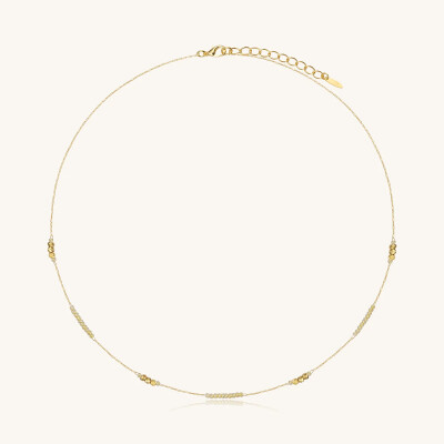 Collier Sàntibé Bijoux Murmure Rond en laiton, métal doré et perles camomille