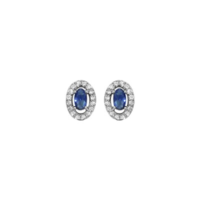 Boucles d'oreilles tige argent rhodié forme ovale verre bleu foncé entourage oxydes blancs sertis