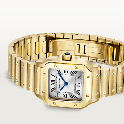 Montre Santos de Cartier Petit modèle, mouvement quartz, or jaune, bracelets métal et cuir interchangeables