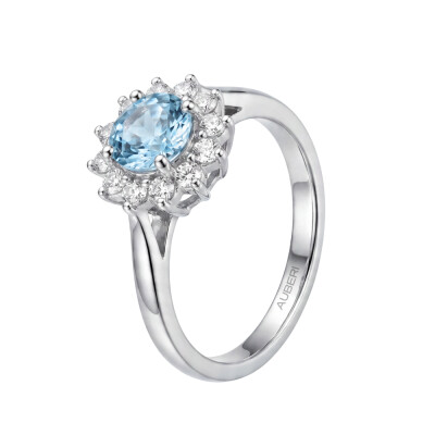 Solitaire Colette en or blanc palladié, zircon bleu de 0,32cts et 12 diamants ronds brillants de 0.17ct
