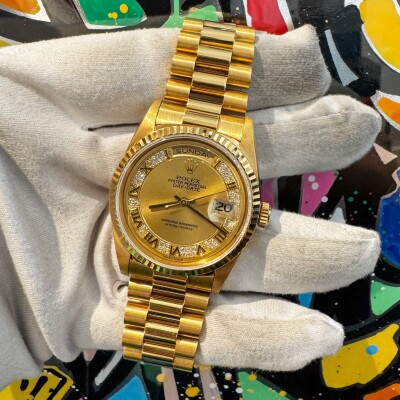 Montre Rolex Day Date 18238 Myriad Diamonds.
