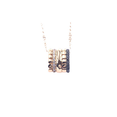Pendentif en or rose, diamants et diamants noirs traités