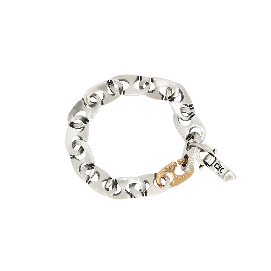 Bracelet en métal argenté et maillon plaqué or