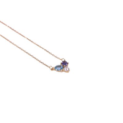 Collier en or jaune, iolite, tanzanite et oxyde de zirconium