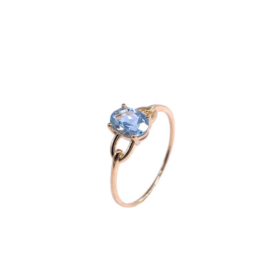 Bague en or jaune et topaze bleue traitée