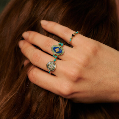 Sophie d'Agon Gaia 5 Turquoise Ring in yellow gold, featuring sky-blue sapphires, navy-blue sapphires, emeralds, and turquoises
