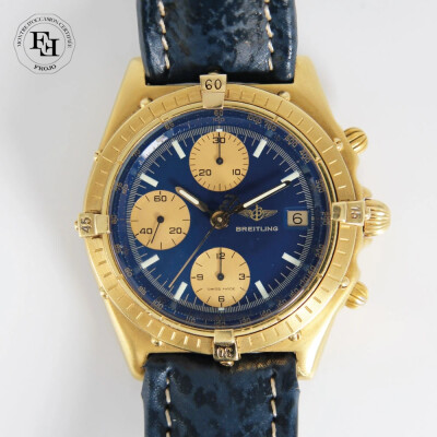 Montre Breitling Chronomat vintage automatique or jaune cadran bleu compteurs dorés bracelet cuir bleu 39mm