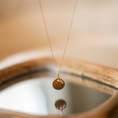 Pendentif jeton motif étoile en or jaune