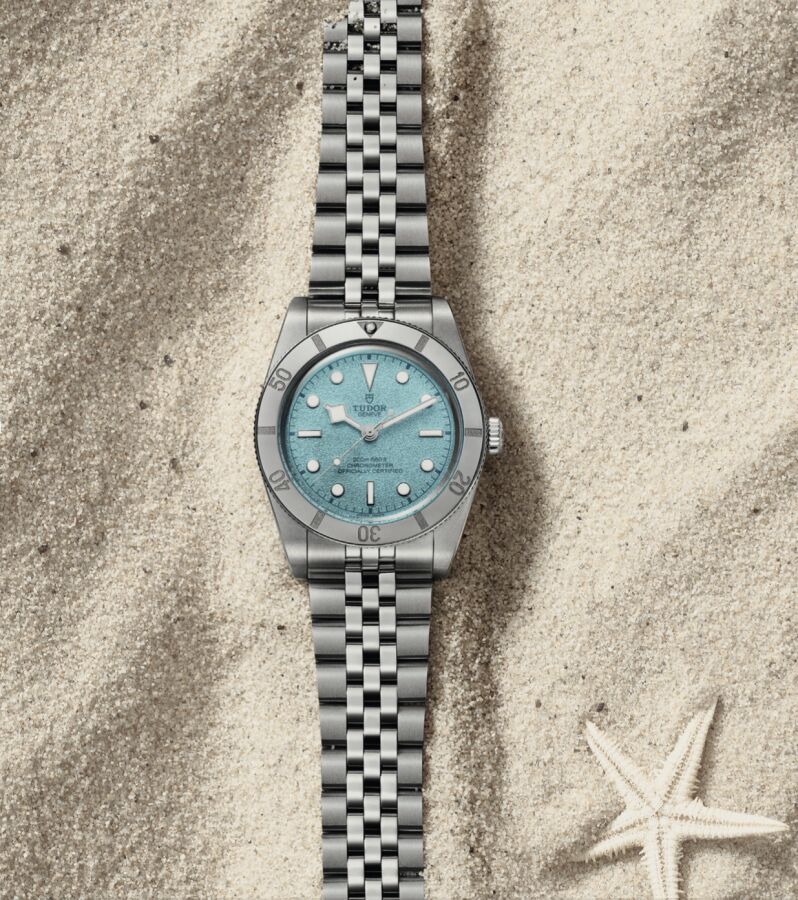 New TUDOR Black Bay 54 Lagoon Blue front view on sand