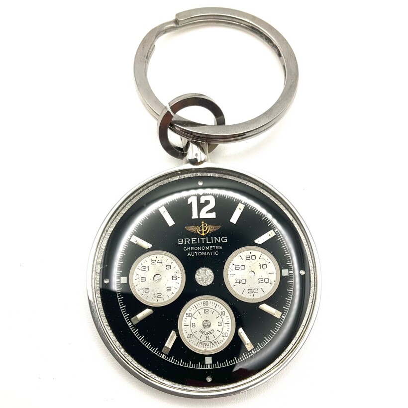 Porte clés acier avec cadran de montre breitling de couleur noir.