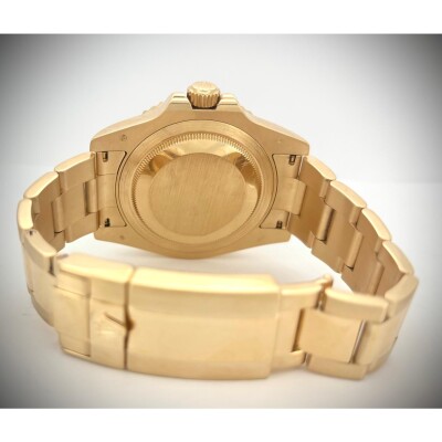 Montre Rolex Gmt-master II Or jaune cadran noir