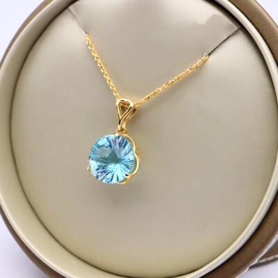 Pendentif or jaune et topaze bleue