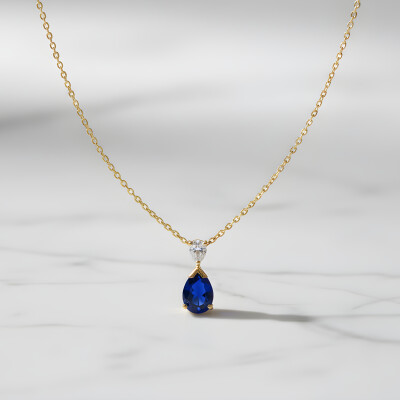 Pendentif or jaune saphir taille poire et diamant taille poire