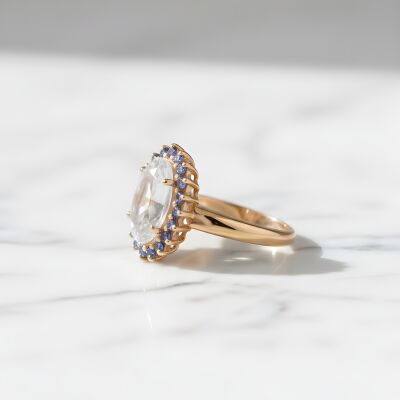 Bague or rose, aigue marine et entourage saphirs