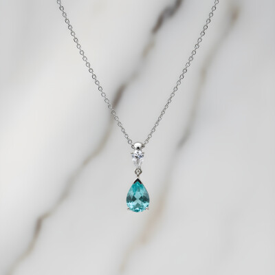 Pendentif or blanc et tourmaline paraïba taille poire