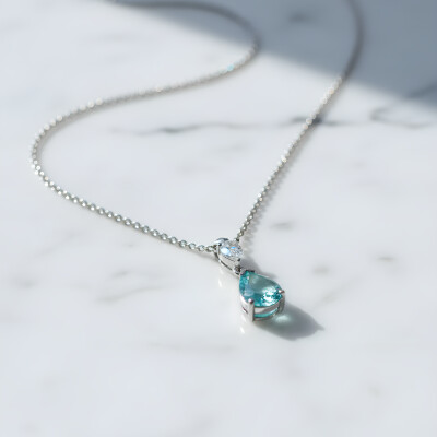 Pendentif or blanc et tourmaline paraïba taille poire