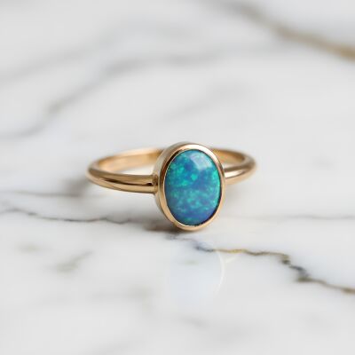 Bague or rose doublet opale noire